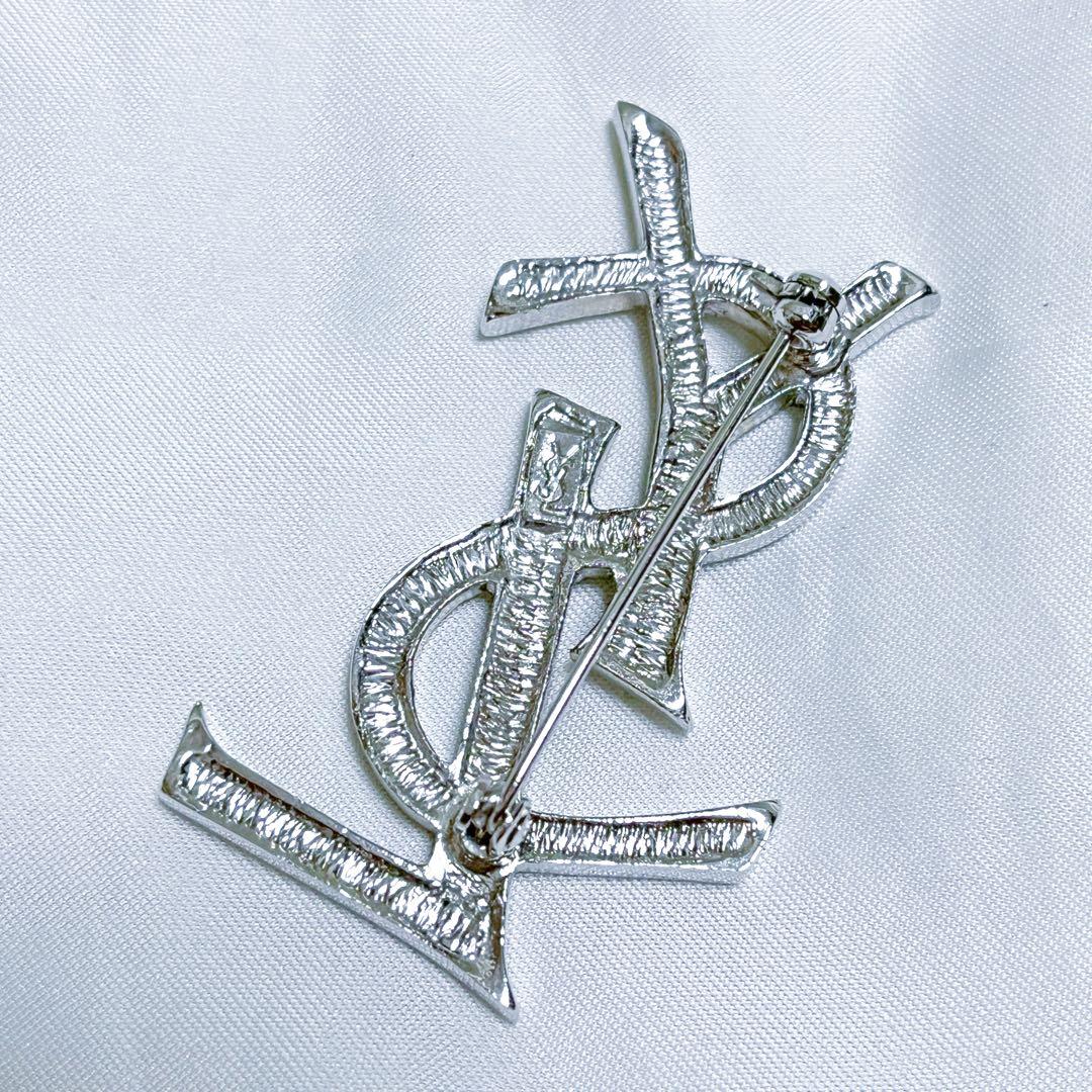 イヴサンローラン ブローチ カサンドラ YSLロゴ　ラインストーン シルバー