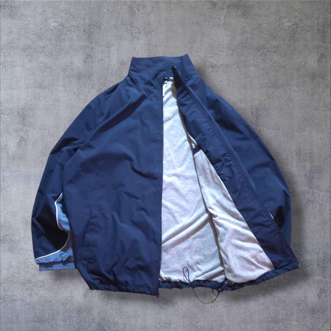 90s Reebokリーボックナイロンジャケット 刺繍ロゴ万国旗タグビッグサイズ