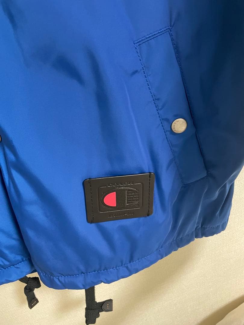 coach × Champion フーディージャケット