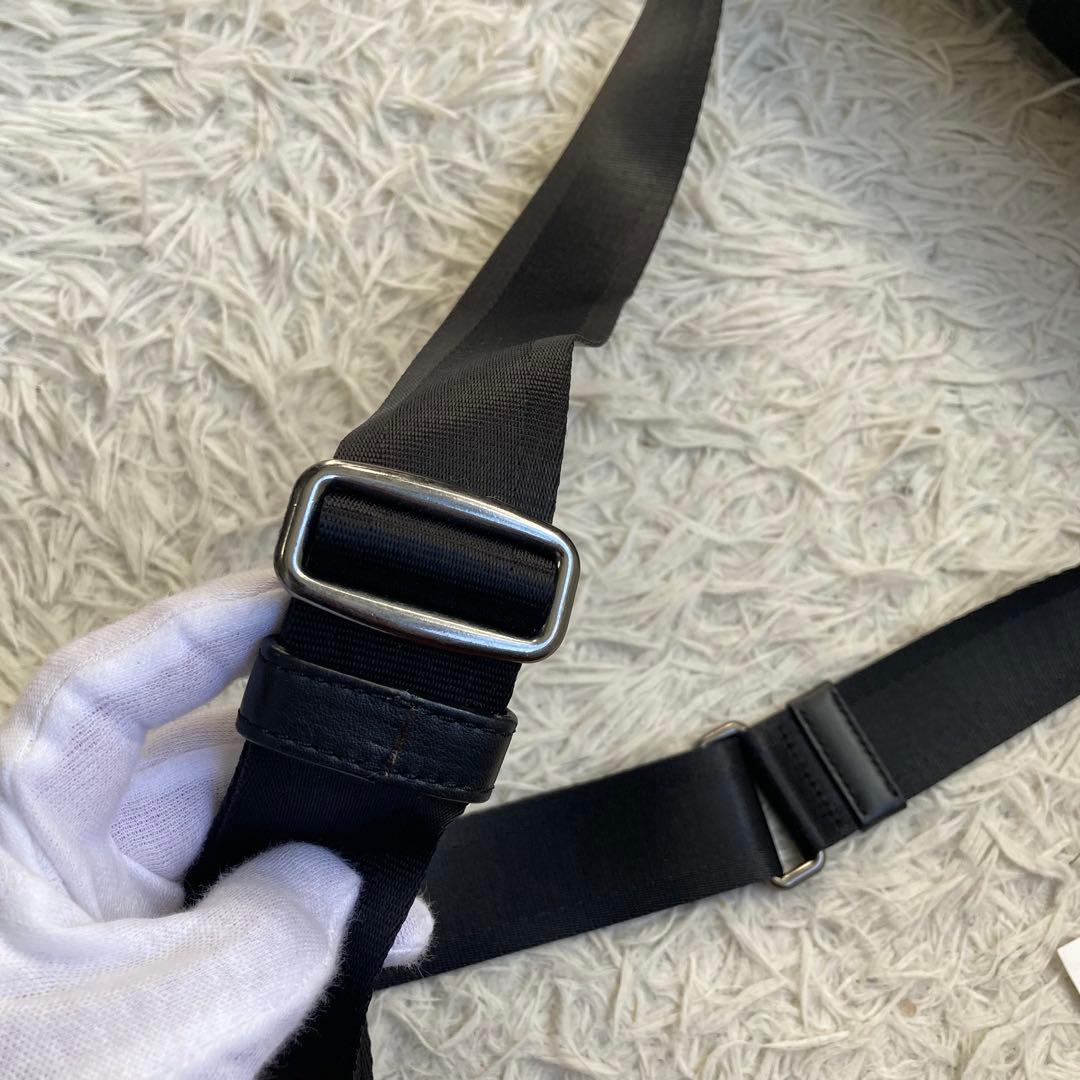 COACH フライトバッグ 黒 ブラック パンチング レザー 革 バックル