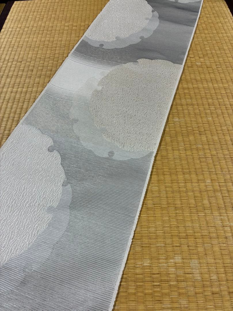 粋でモダンな装い！西陣全通名古屋帯 綿芯本仕立ガード加工済　雪輪文 簡易包装