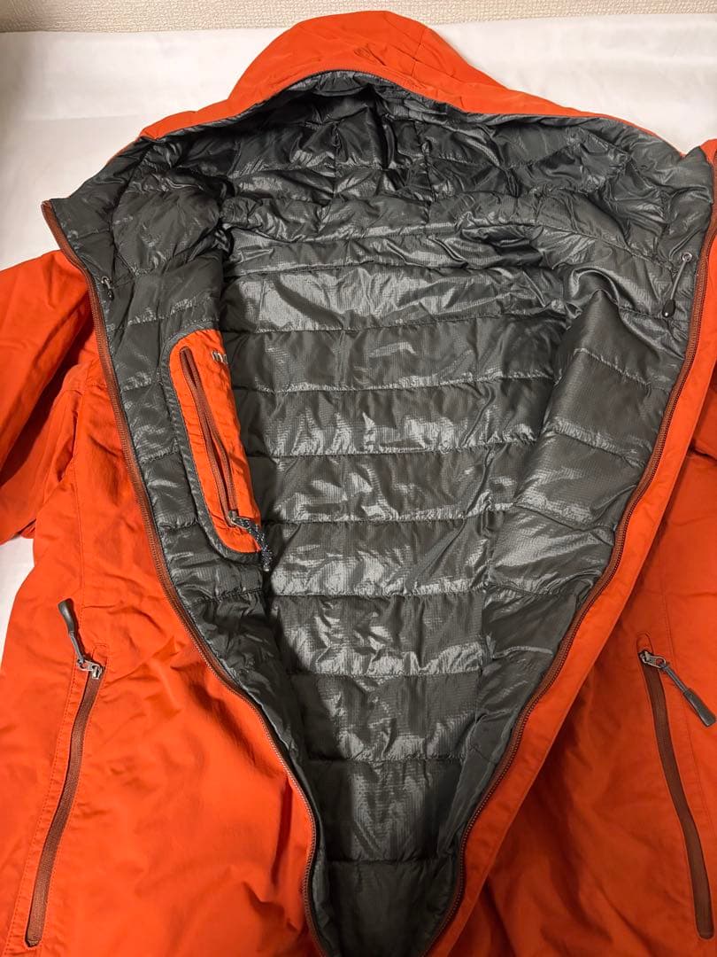人気モンベル725FP コロラドパーカ　メンズLリバーシブルダウンオレンジグレー