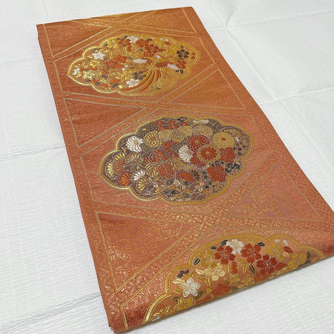 梅垣織物　袋帯　西陣織　七宝菱蒔絵文　正絹　金糸　オレンジゴールド系　逸品