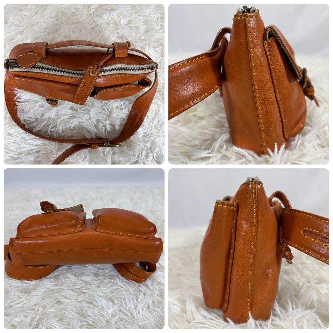 ダコタ ボディバッグ 斜め掛け 肩かけ ロゴ型押し ヌメ革 ベルト ユニセックス