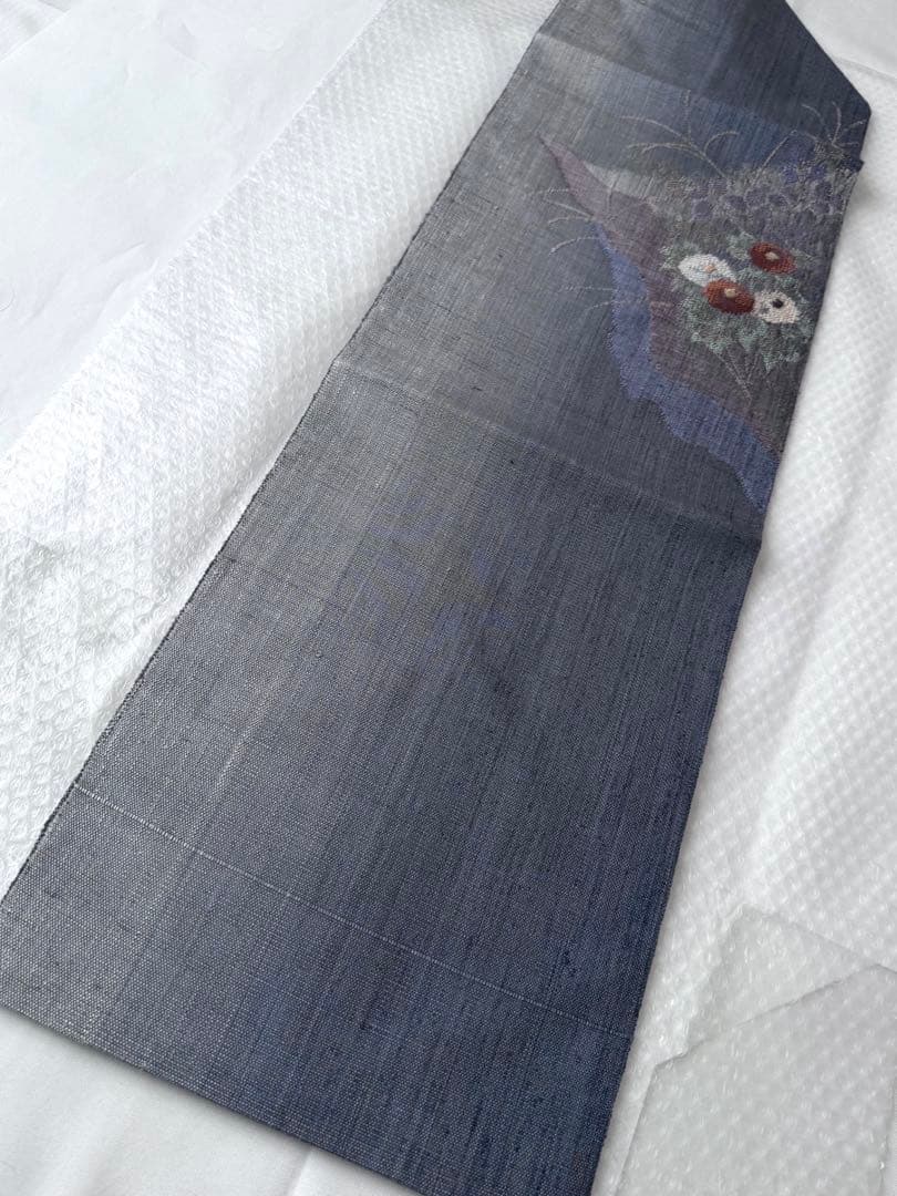 N34 美品 手織り真綿紬 万寿菊模様織出し 正絹 名古屋帯 ブルーグレー 暈し