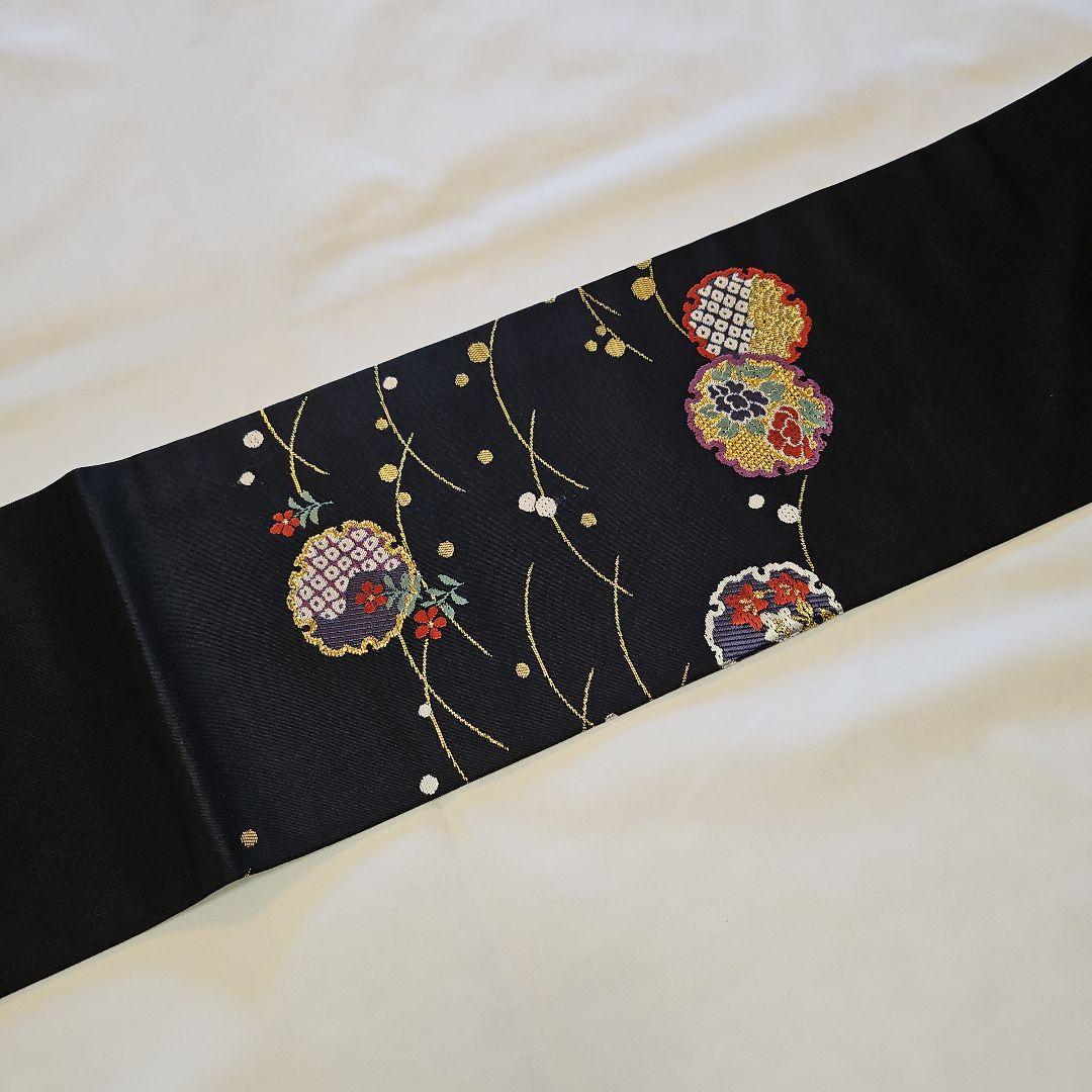 名古屋帯☆雪輪文様☆九寸☆露草☆正絹☆セミフォーマル☆黒地☆金彩