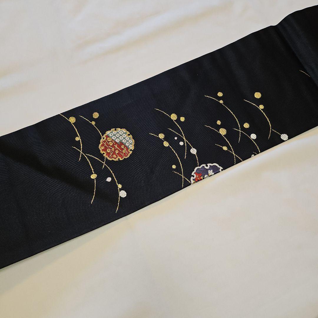 名古屋帯☆雪輪文様☆九寸☆露草☆正絹☆セミフォーマル☆黒地☆金彩