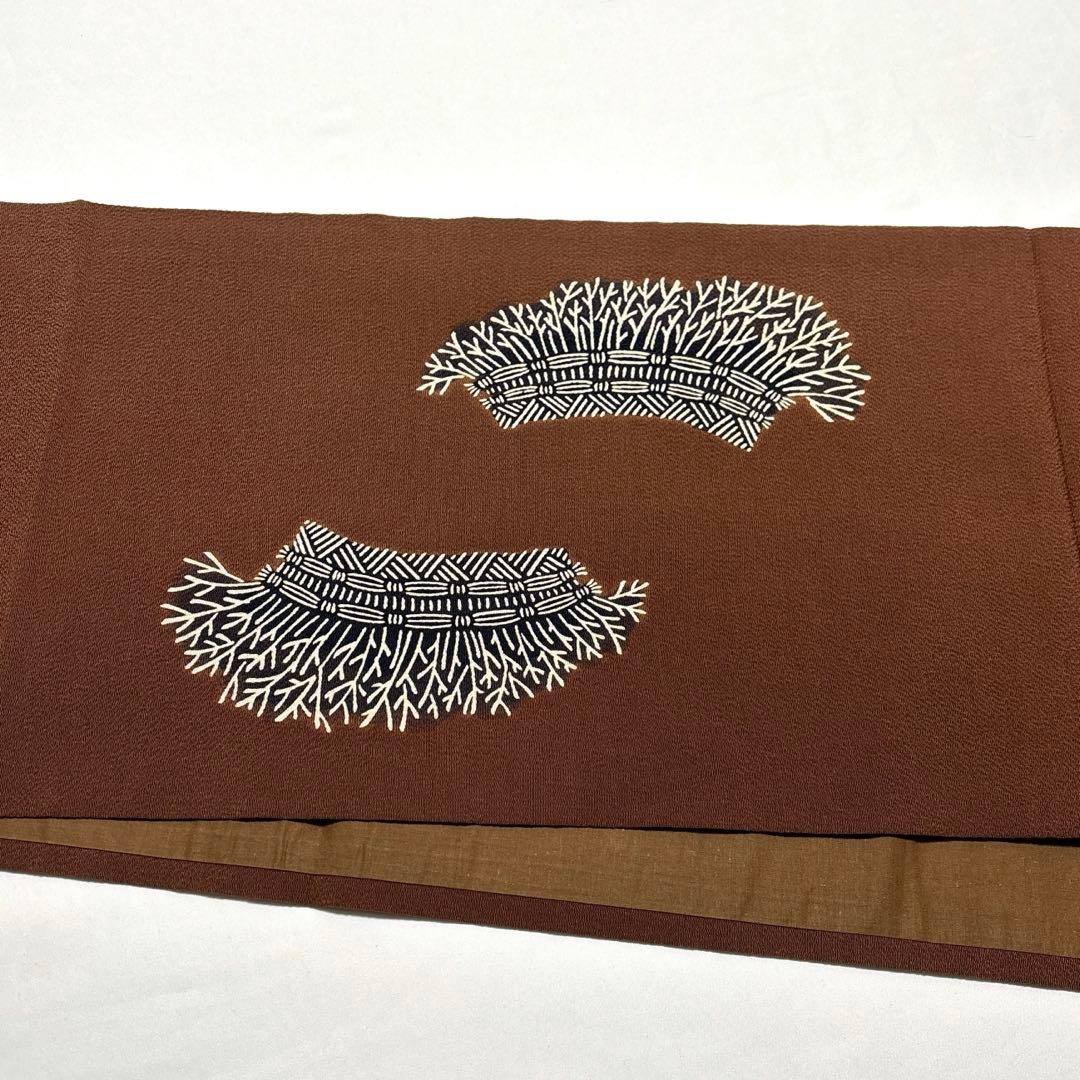 開き名古屋帯【栗山吉三郎】和染紅型 縮緬 垣根文様 茶色 お太鼓柄 正絹 九寸帯