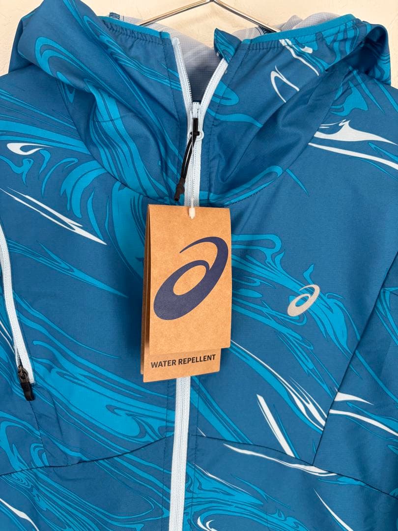 ASICS アシックス　撥水性グラフィックウーブンジャケット　Sサイズ　水色