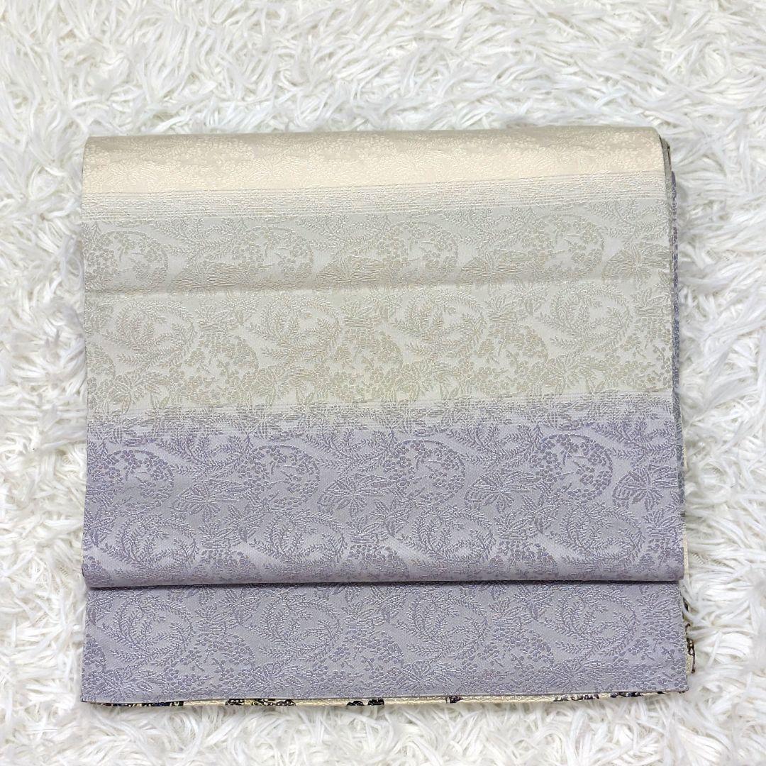 【全通柄】正絹袋帯　白地に蝶・花文様の紅型調　両面使用可　淡紫〜生成りのぼかし調