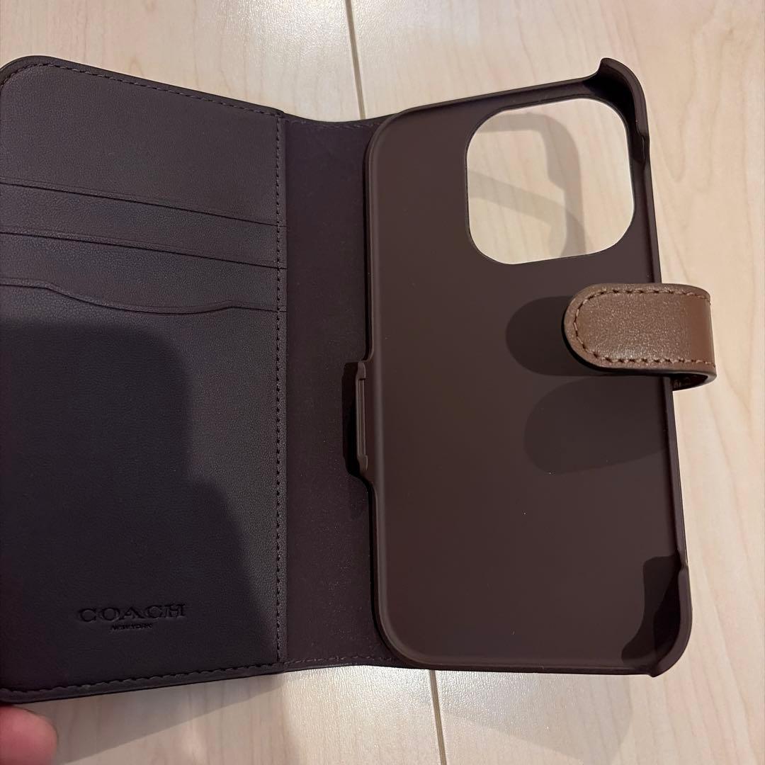 コーチiPhone15 PRO ケース シグネチャー 手帳型 スマホケース 収納