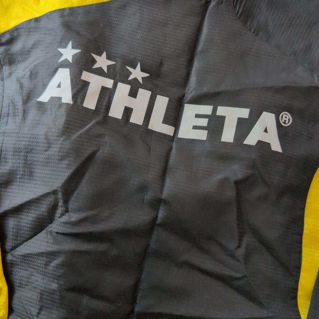ATHLETA ピステ上下セット 150 黒/黄色