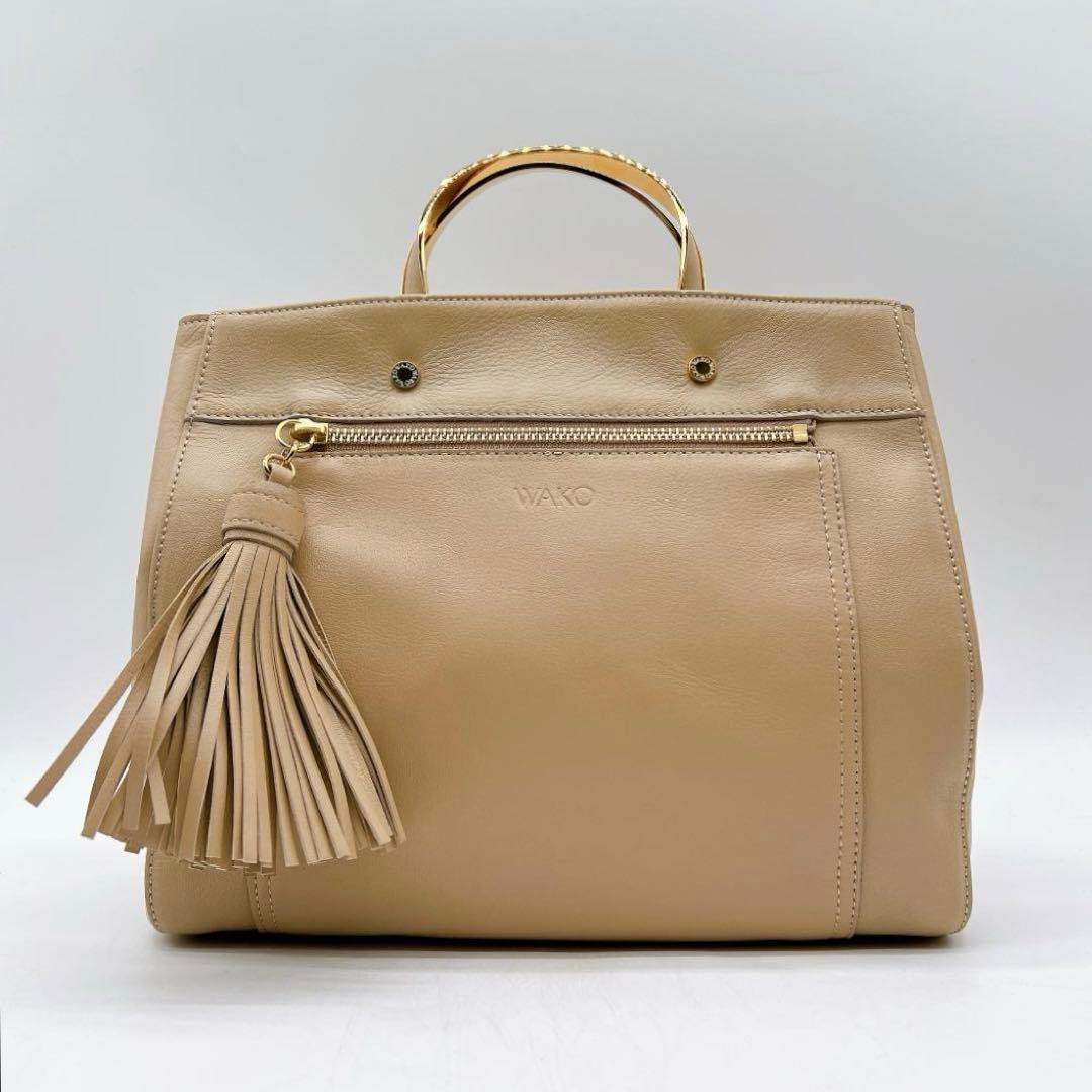極美品WAKO ゴールドハンドル ハンドバッグ タッセル レザー f557