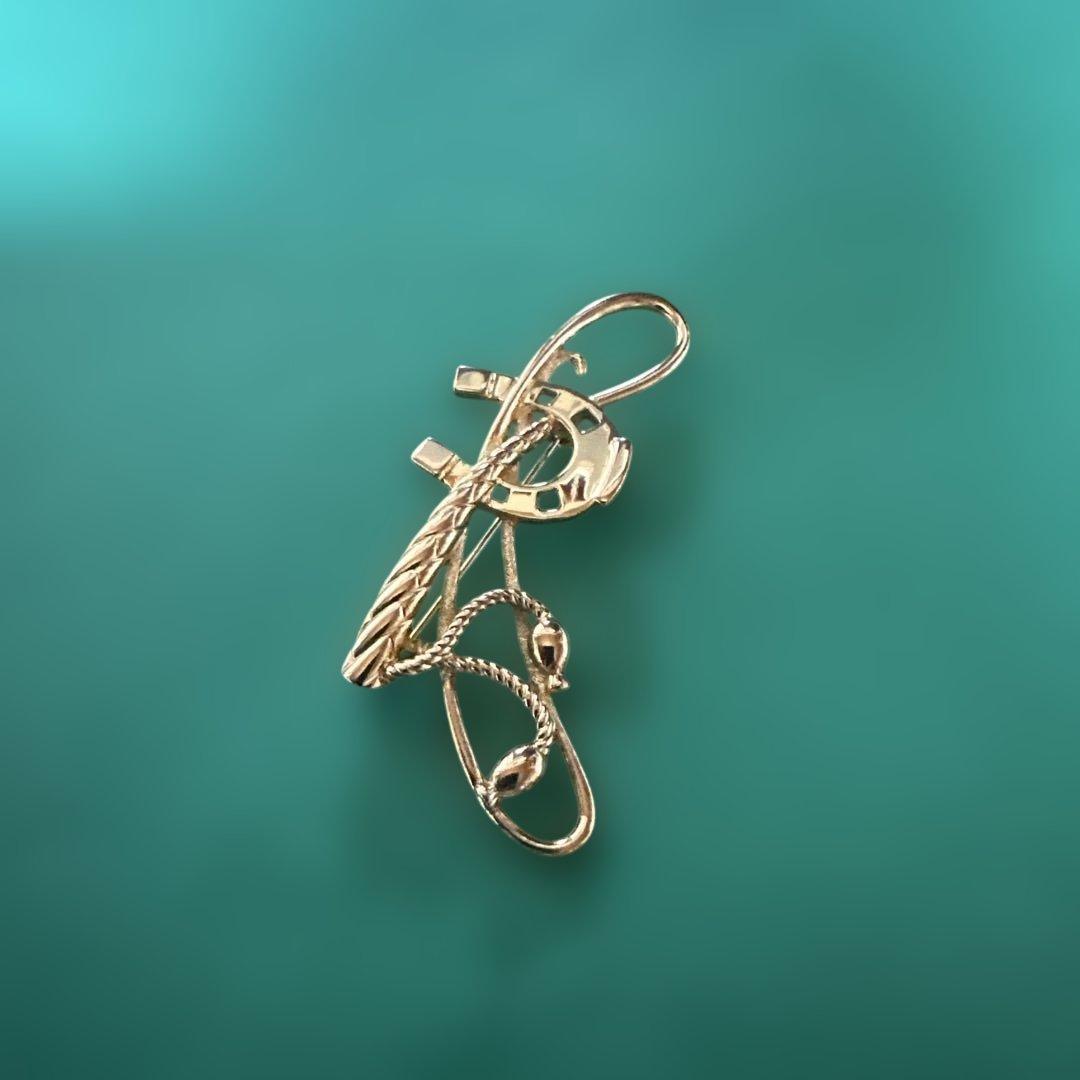 BURBERRY ゴールドブローチ