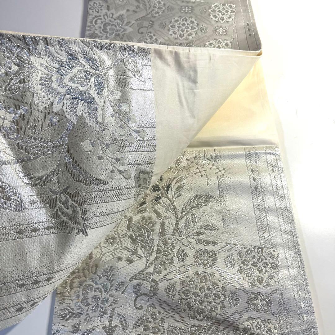 5k2480 袋帯　絹　唐織　正倉院文様　華文　白　銀色　ピンク　青　花柄　和装