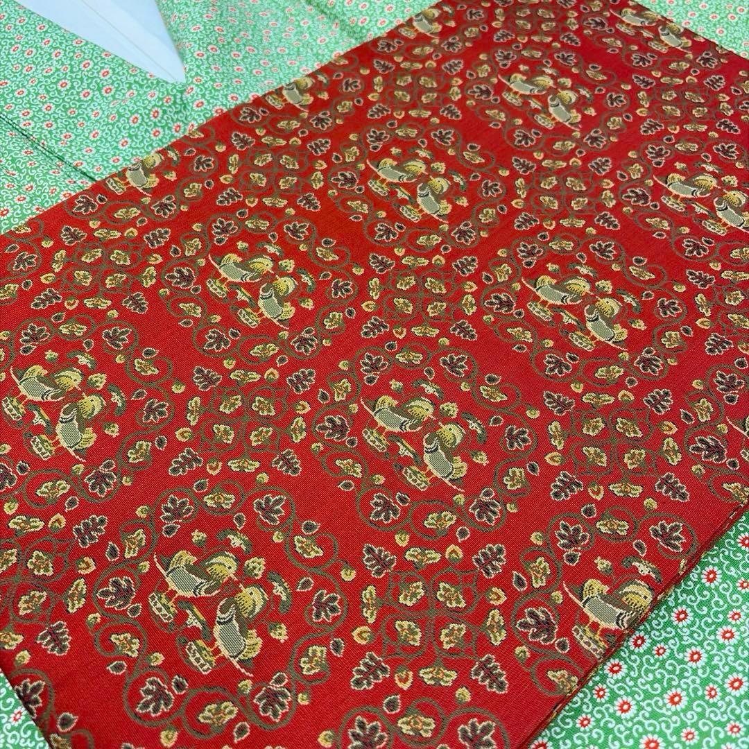 龍村美術織物-名古屋帯-赤￼地鴛鴦唐草柄￼