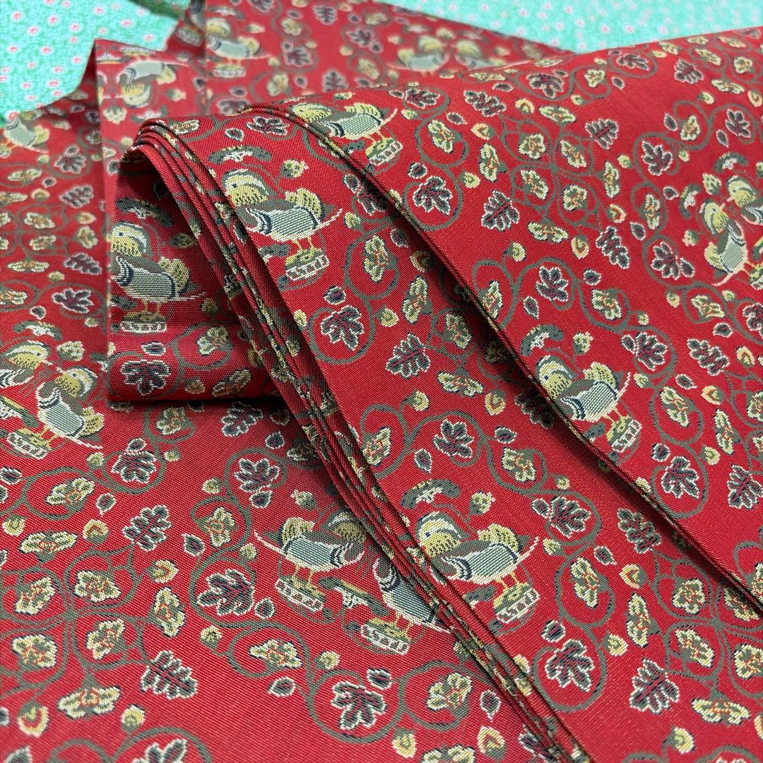 龍村美術織物-名古屋帯-赤￼地鴛鴦唐草柄￼