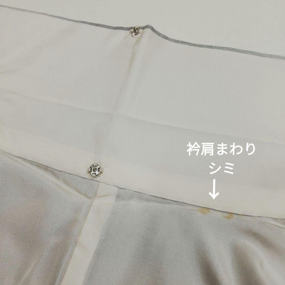 真綿紬(袷)　(織出し宝相華紋様　飛び柄　ぼかし　白鼠色系)